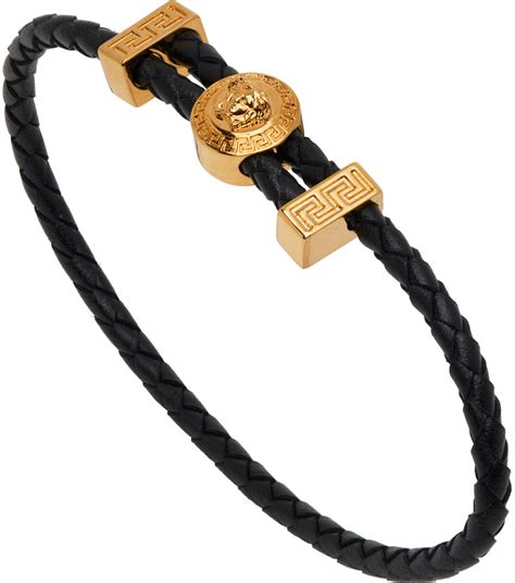 versace black and gold bracelet|Versace goldtone bracelet.